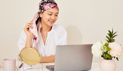Participant watching laptop - tying head scarf.jpg